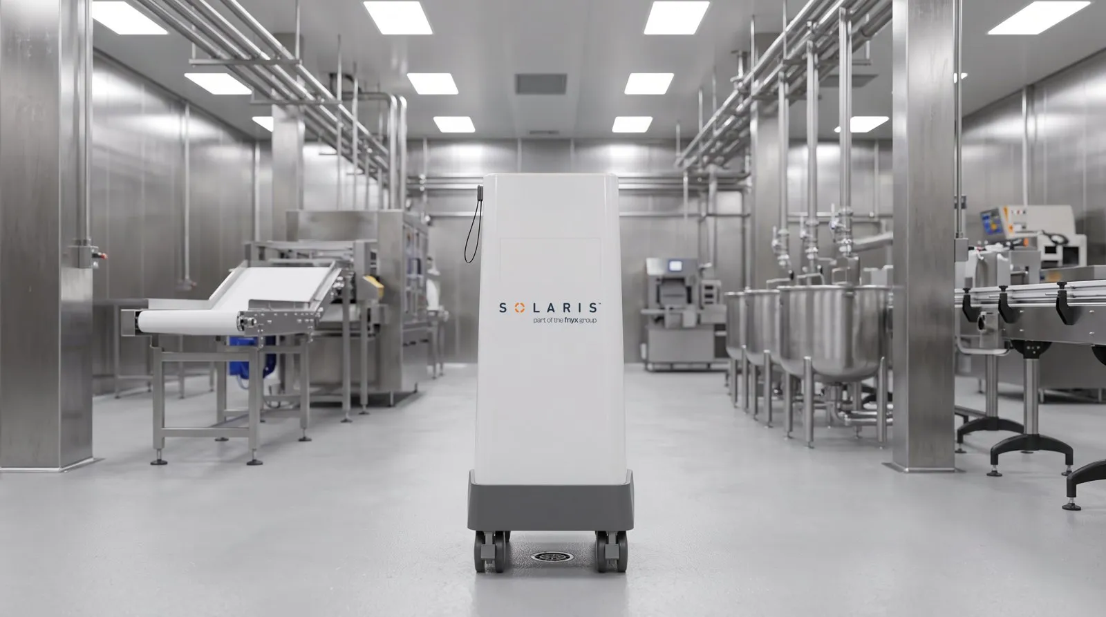 A Solaris pulsed UV unit positioned over a floor drain in a food processing room